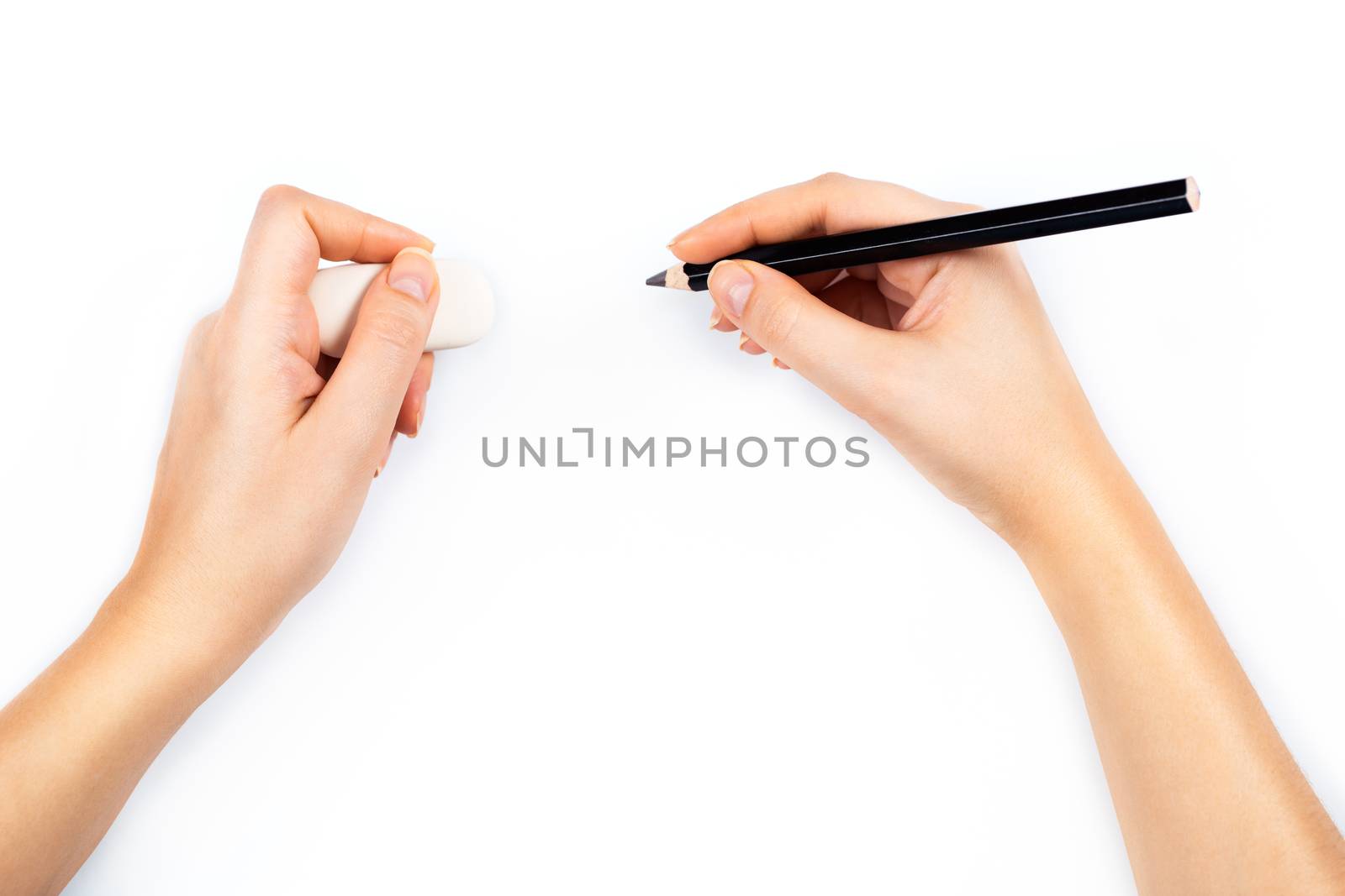 Human hands with pencil and erase rubber writting something. On white background