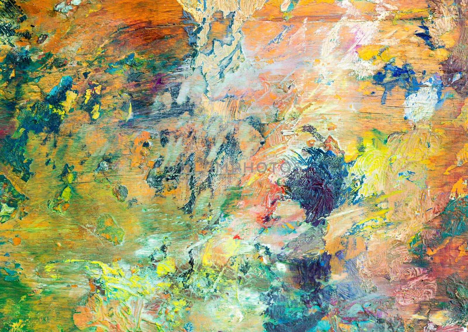 Colorful background made oil paints on a wooden background