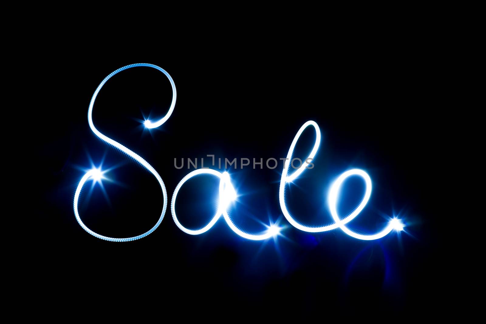 Glowing inscription SALE on a black background