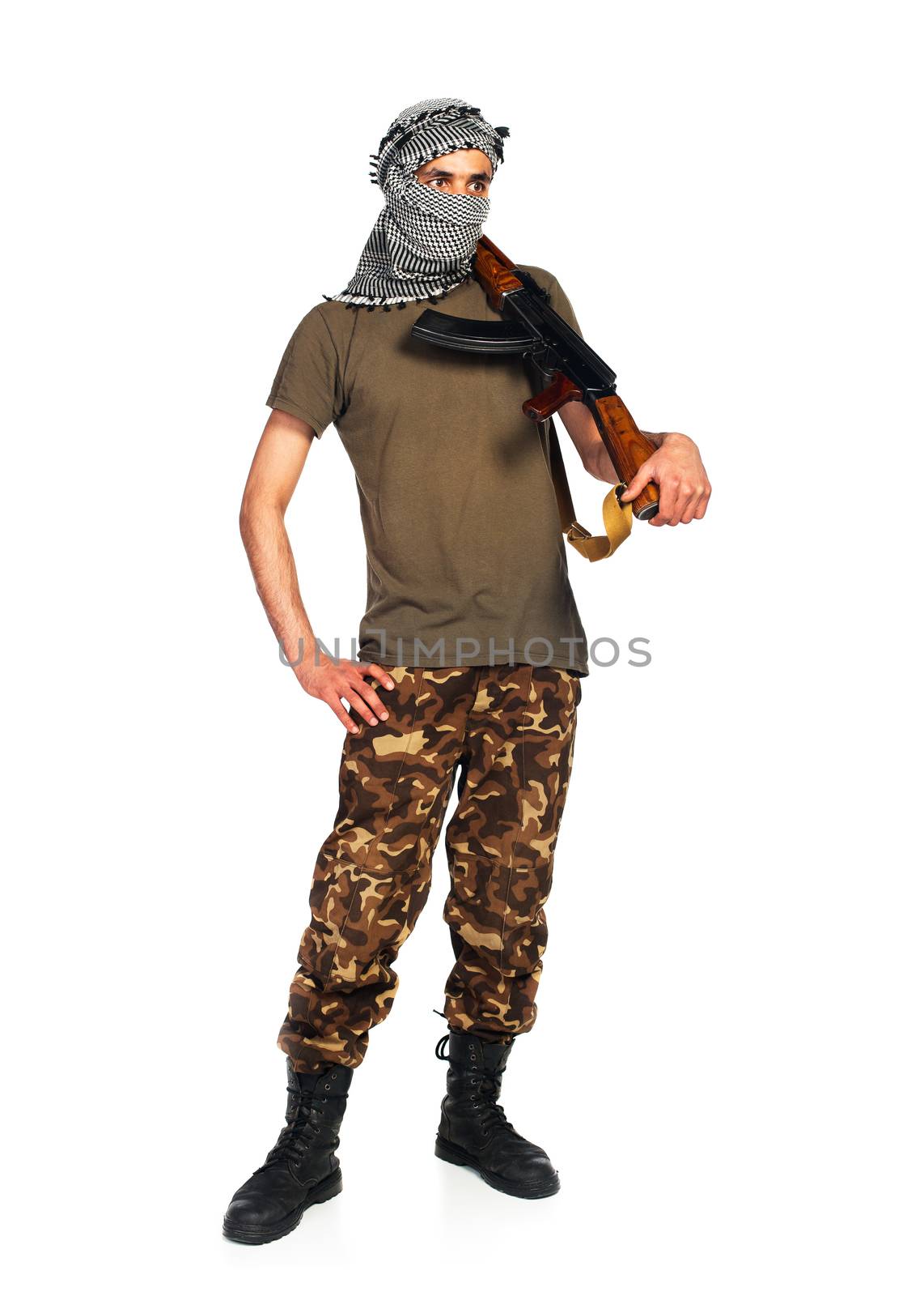 Arab nationality in camouflage suit and keffiyeh with automatic gun on white background with reflection