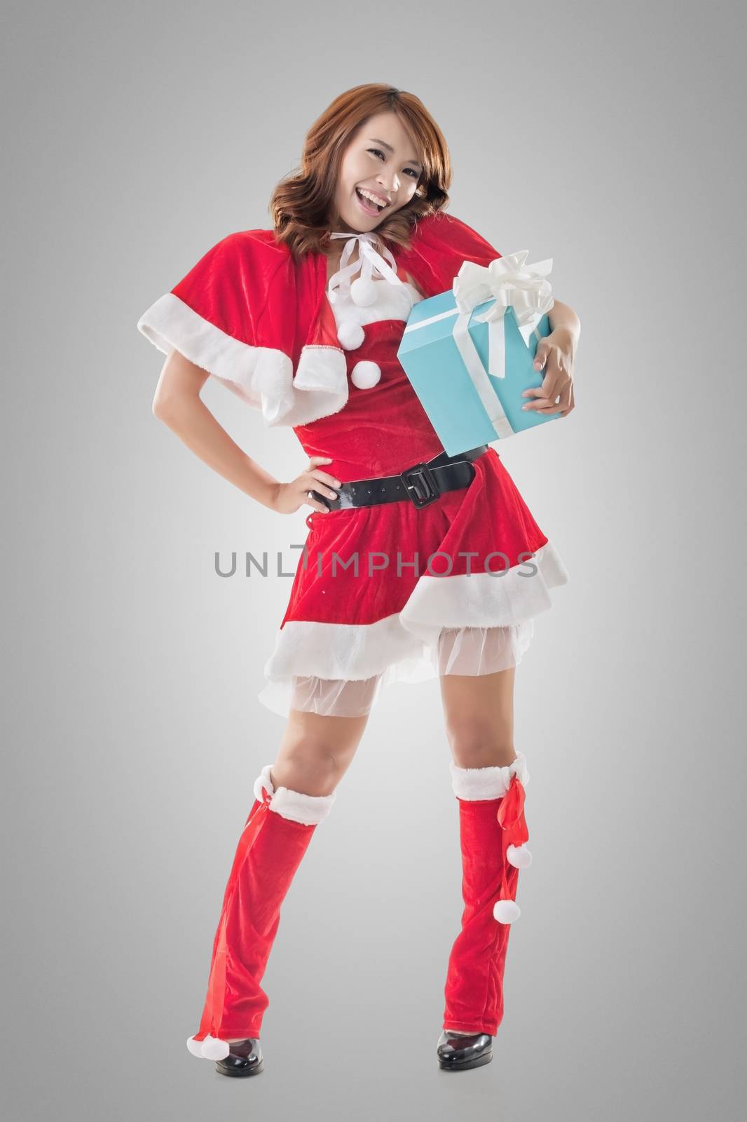 Smile happy Asian Christmas girl hold gift box, isolated full length portrait.