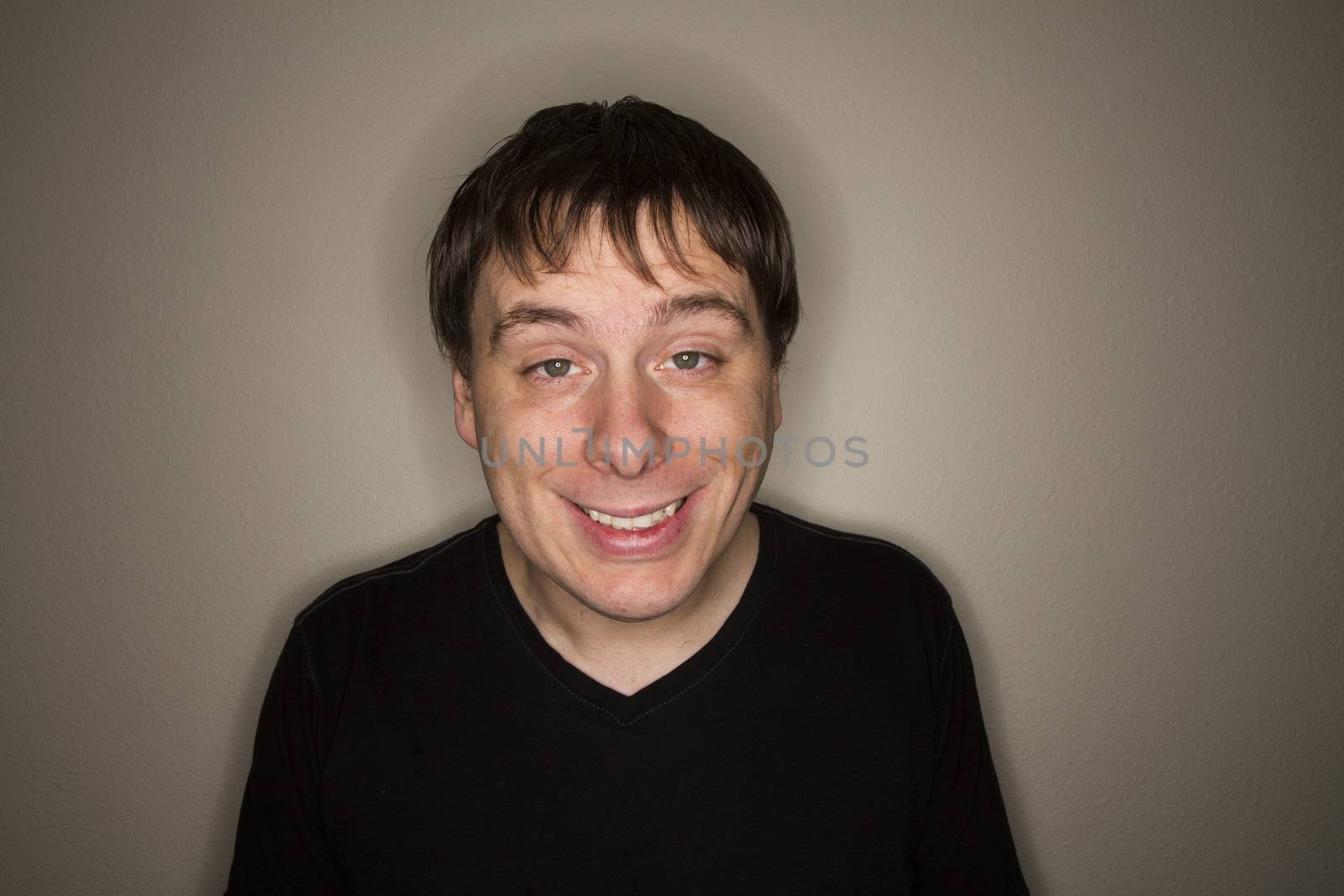 Guy looking at the camera with his eyes half open like he is stoned