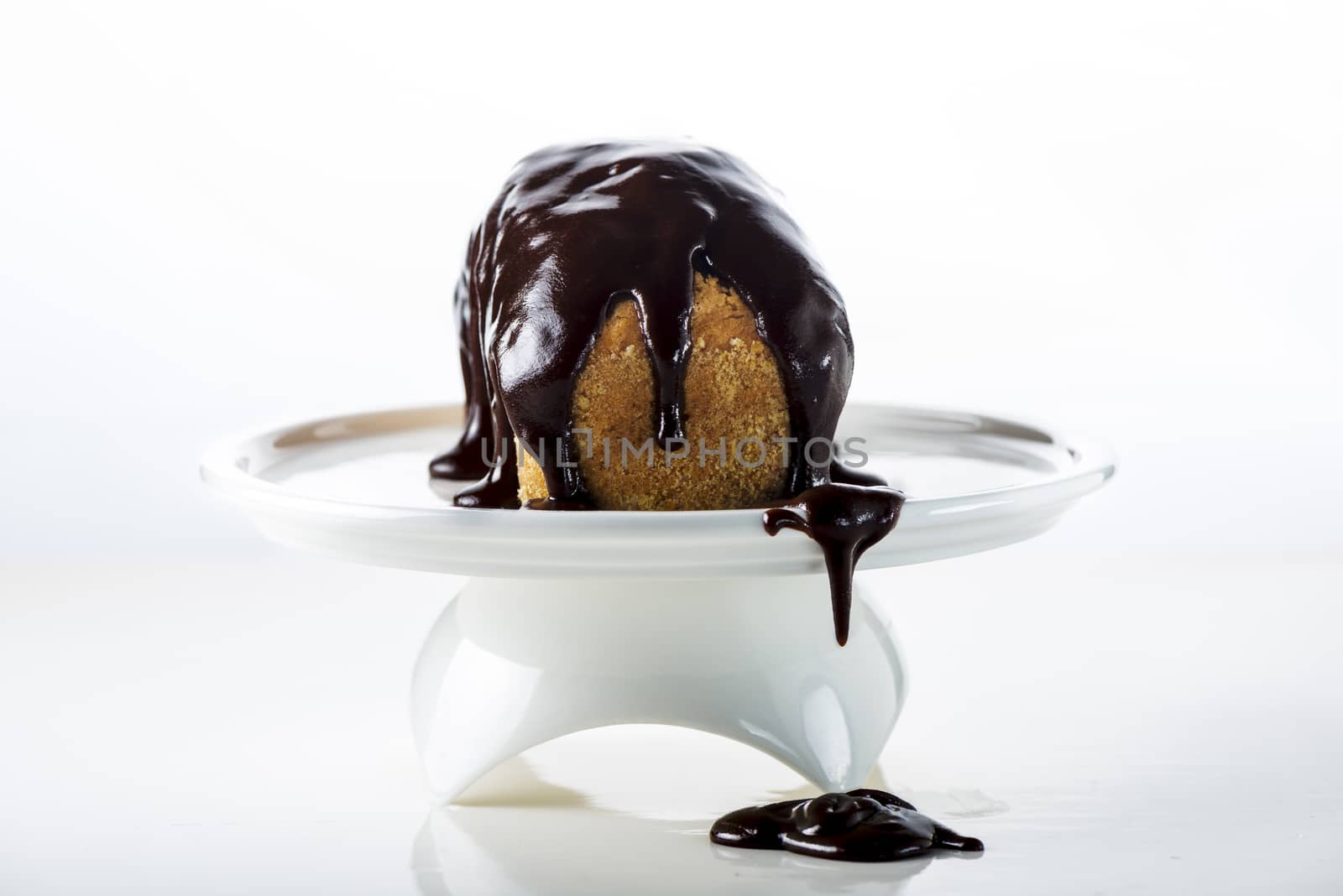 small chocolate cake on white background