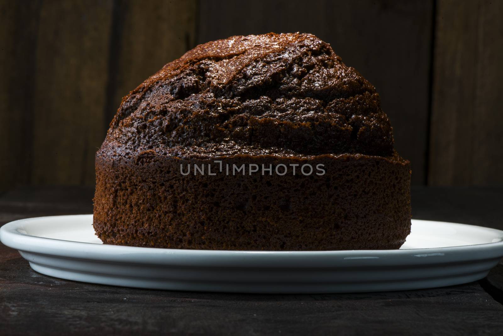 chocolate cake on wood table and wood background