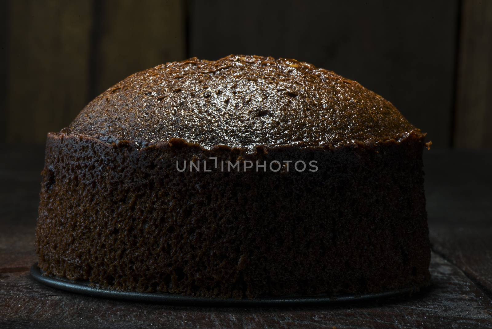 chocolate cake on wood table and wood background