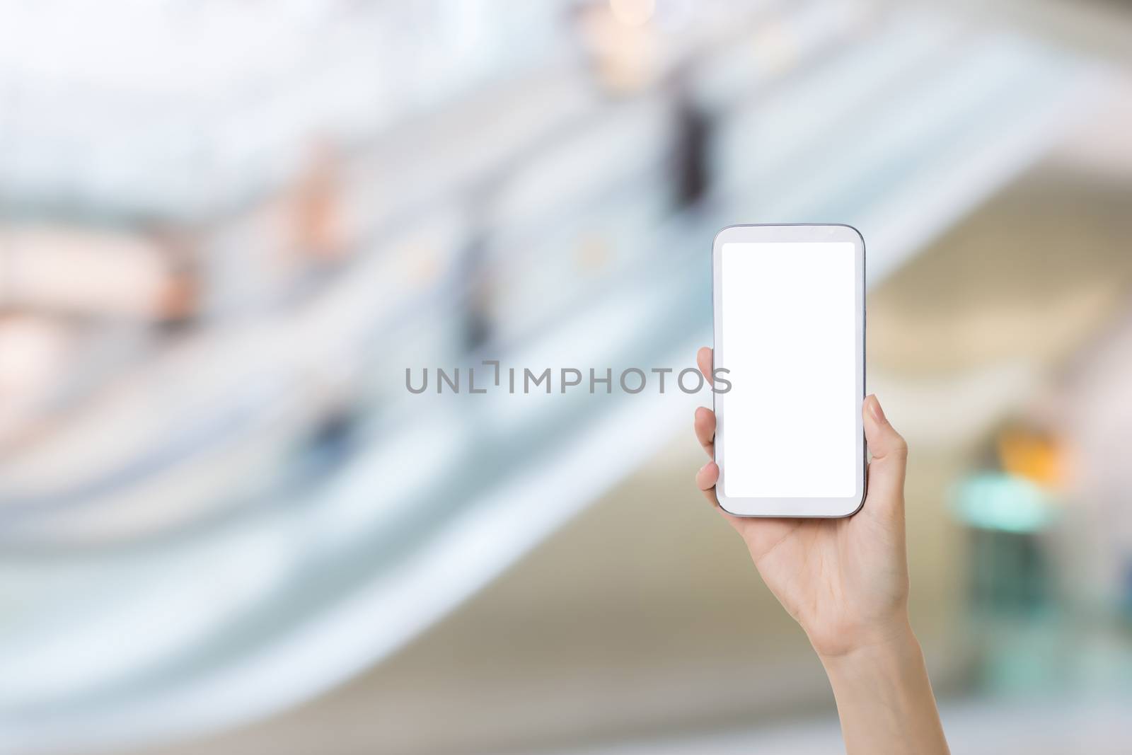 Using smartphone in a market or department store, closeup image.
