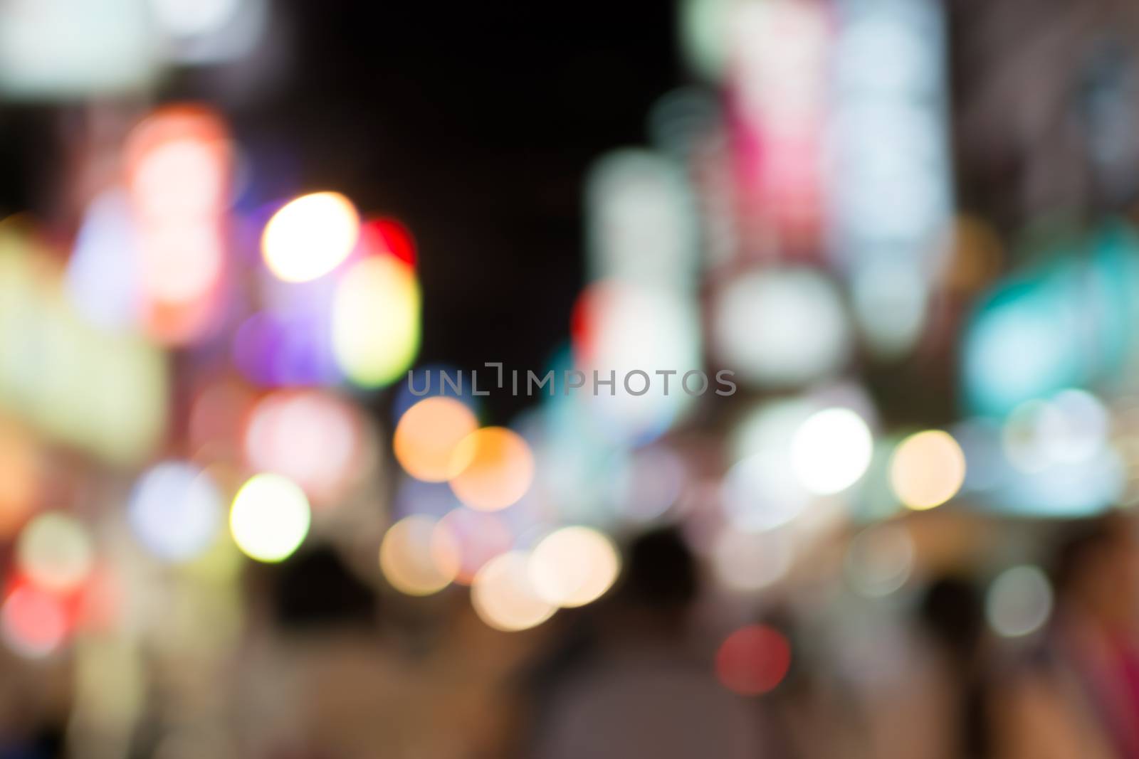 Abstract urban background with blurred buildings and street, shallow depth of focus.