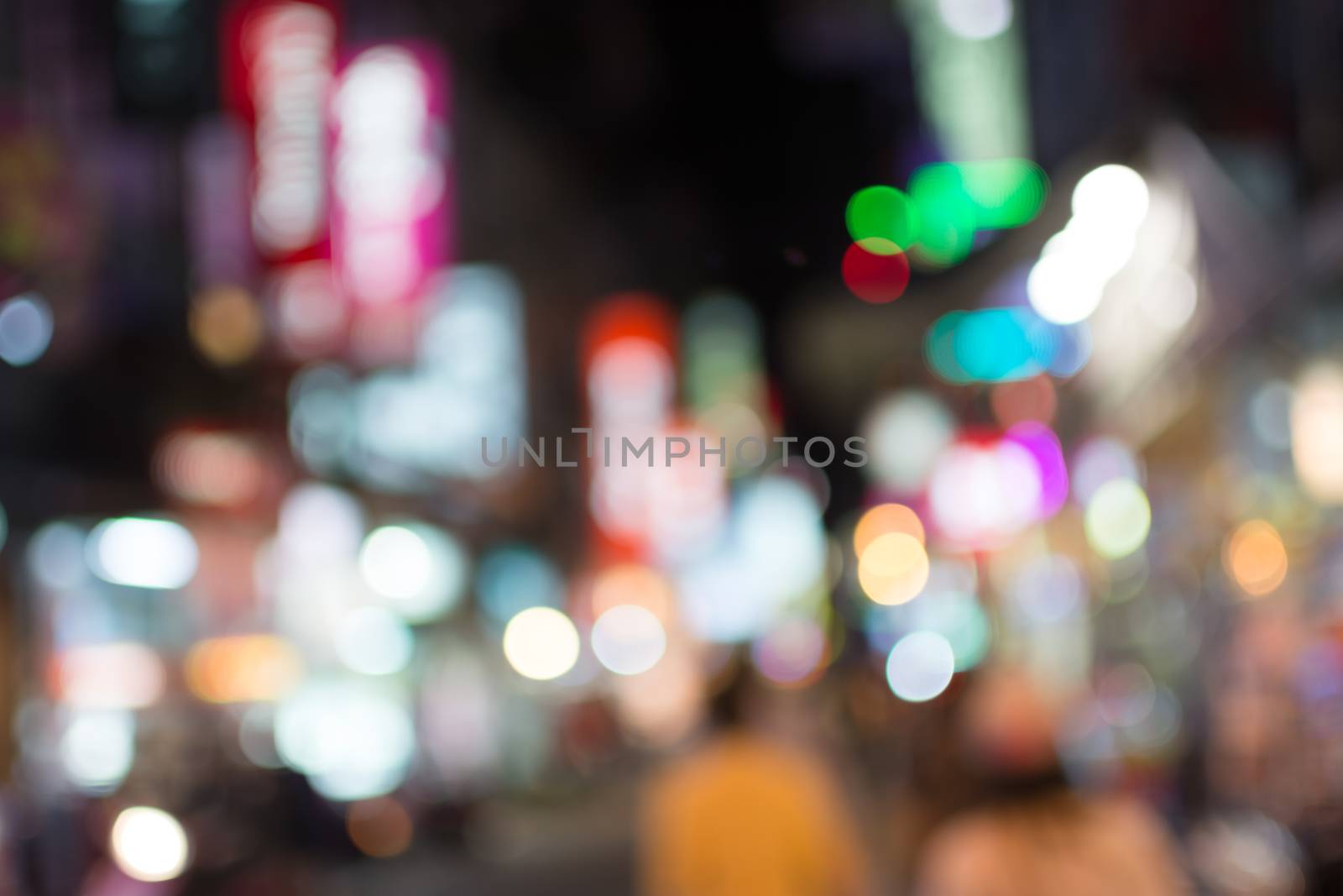 Abstract urban background with blurred buildings and street, shallow depth of focus.