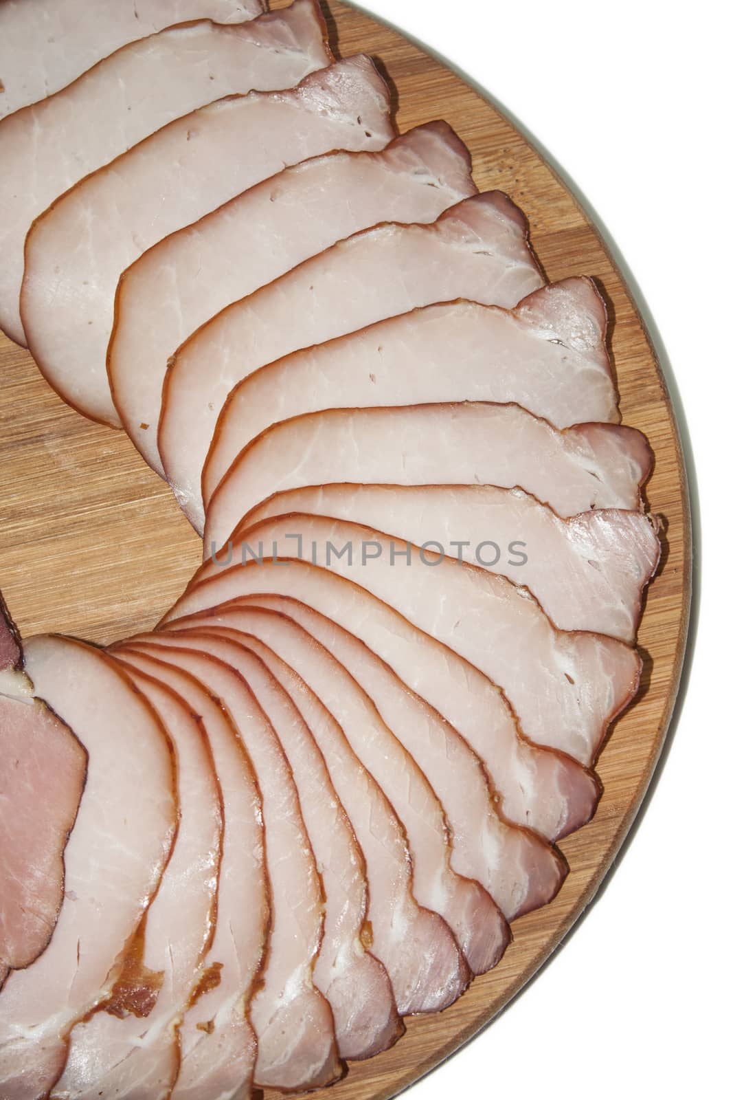 Cutted smoked sirloin on a wooden board by zlajaphoto