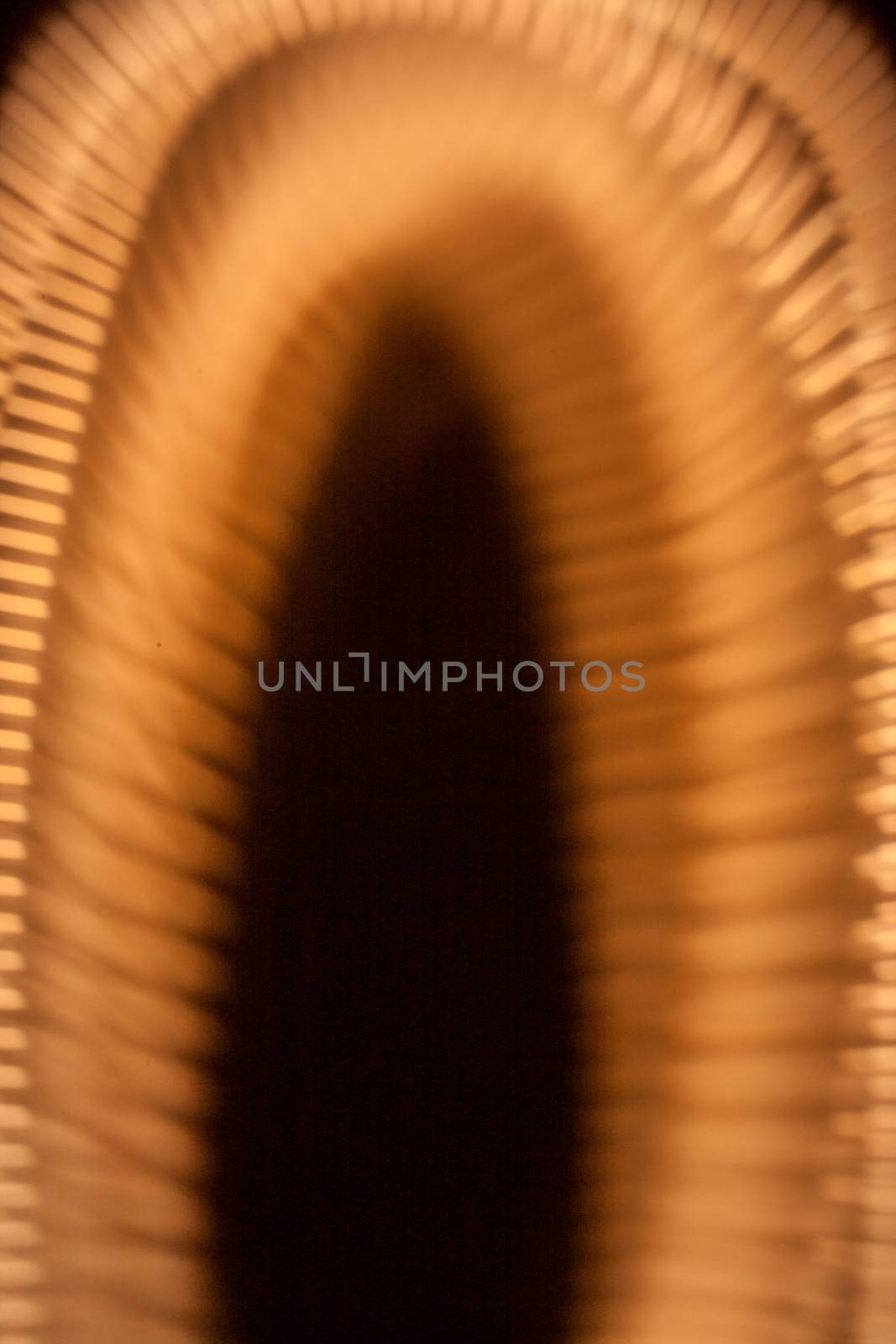 golden arc shaped texture over black background 