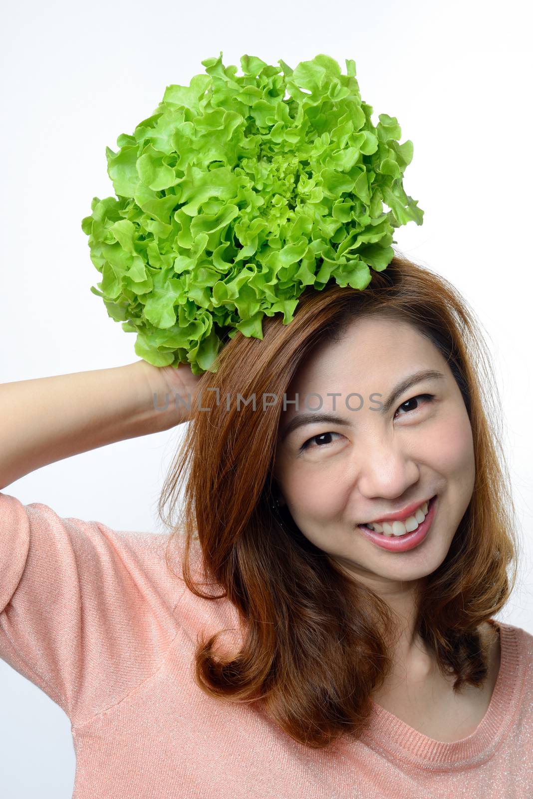 asian woman hold hydroponics green oak vegetable on her head