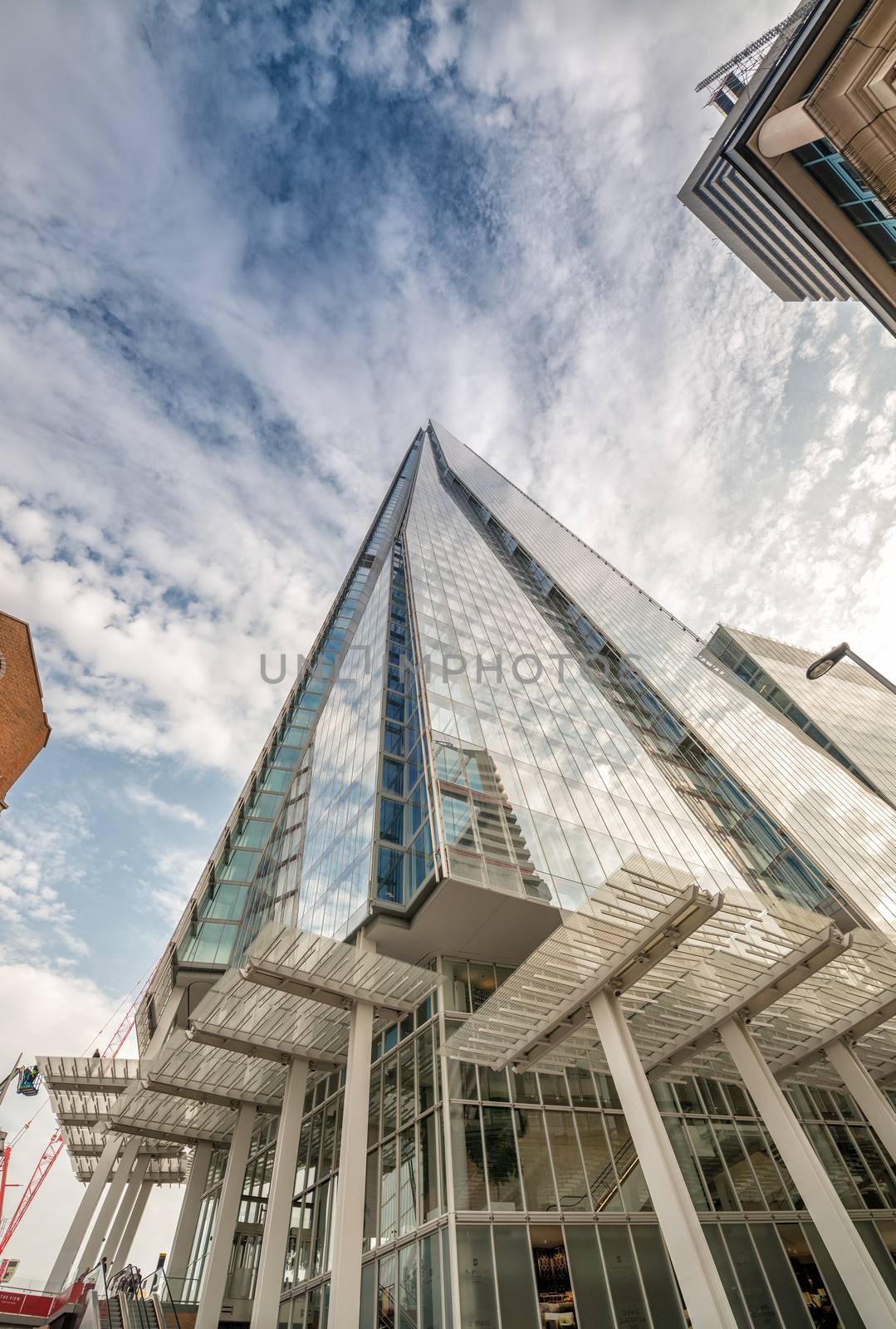 LONDON - SEP 29: The Shard skyscraper designed by Italian architect Renzo Piano has 87 storeys over a height of 1004 feet (306 metres) on September 29, 2013, in central London, UK.