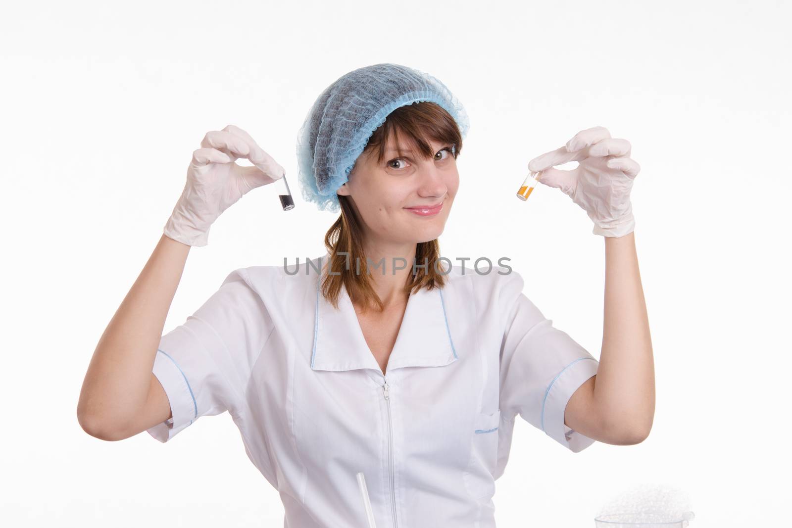 Young beautiful girl posing chemical experiments in the laboratory