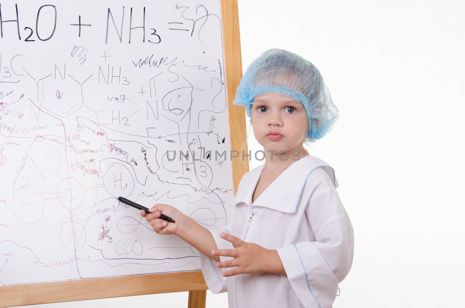 Three year old girl chemist standing at blackboard robe