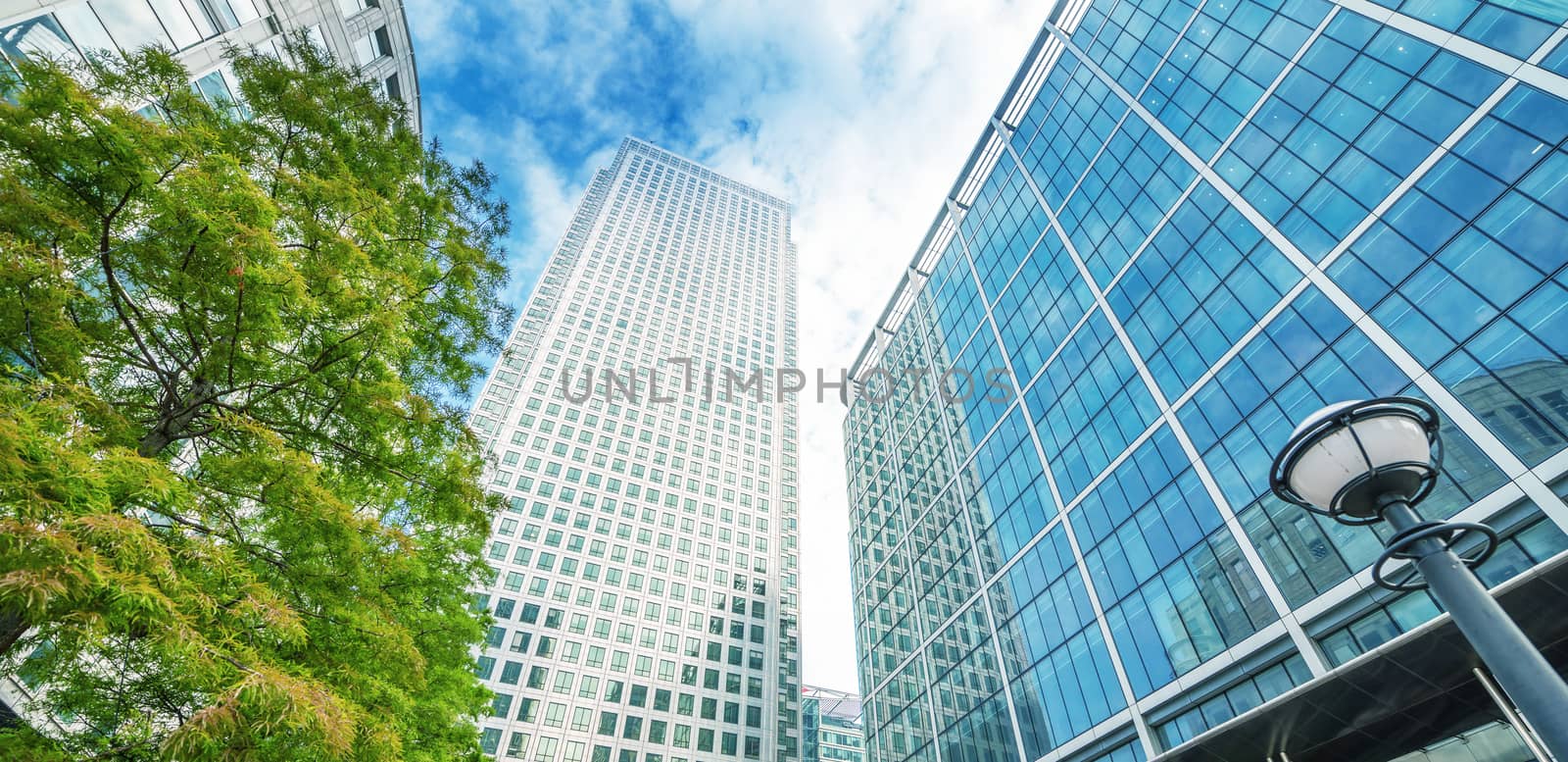 Canary Wharf skyline, office buildings, street view - London.