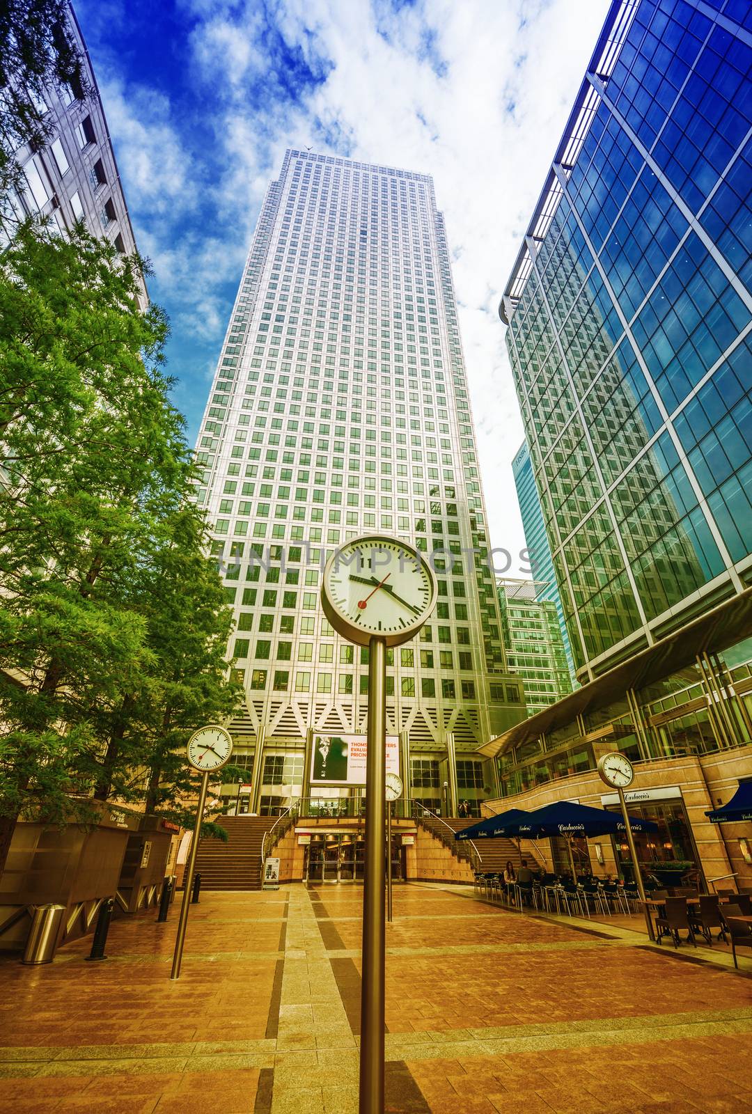 LONDON - SEPTEMBER 28, 2013: Buildings of Canary Wharf as seen from street level. Canary Wharf is a major business district located in Tower Hamlets, London.