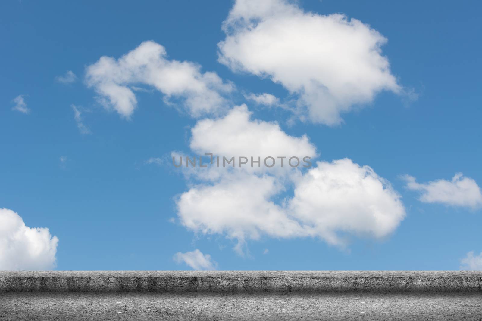 Background of concrete ground with cloudy sky.