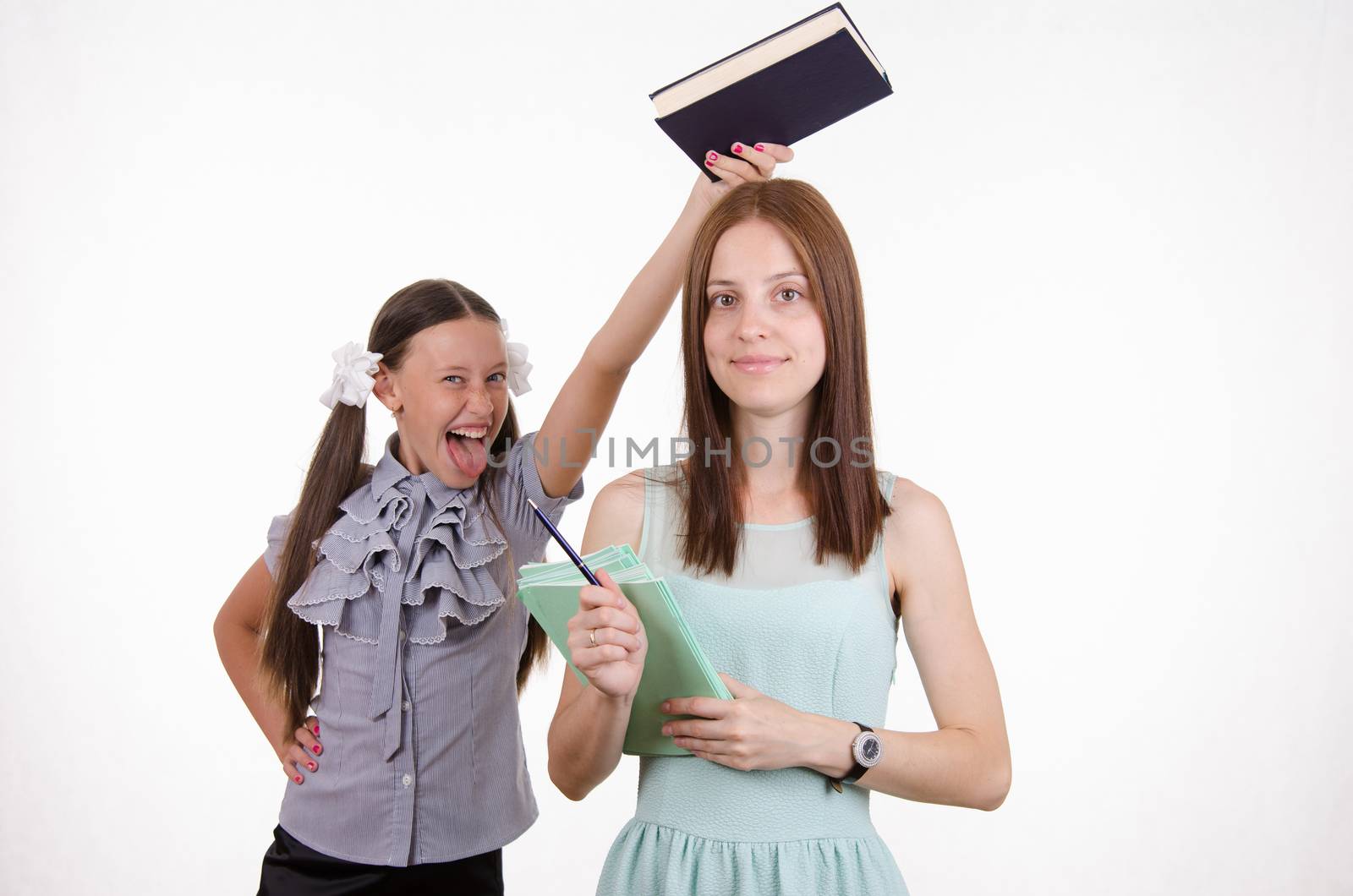 Trainee teacher mocks trying to hit her over the head with a book
