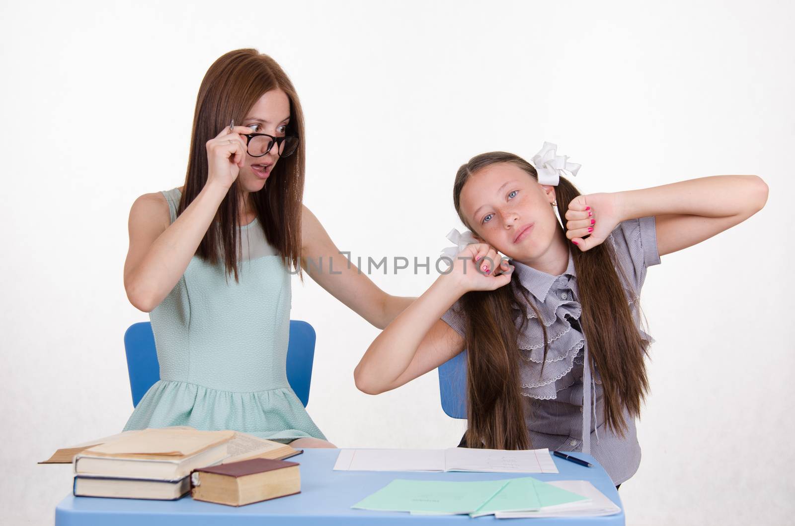 The teacher teaches the student who fell asleep from boredom