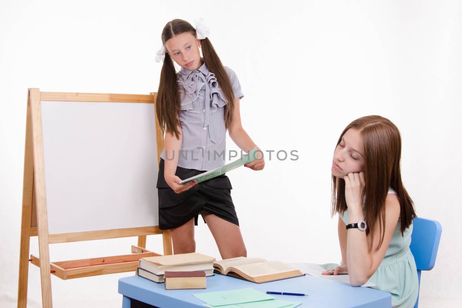 The teacher went to sleep as the student answered at the blackboard