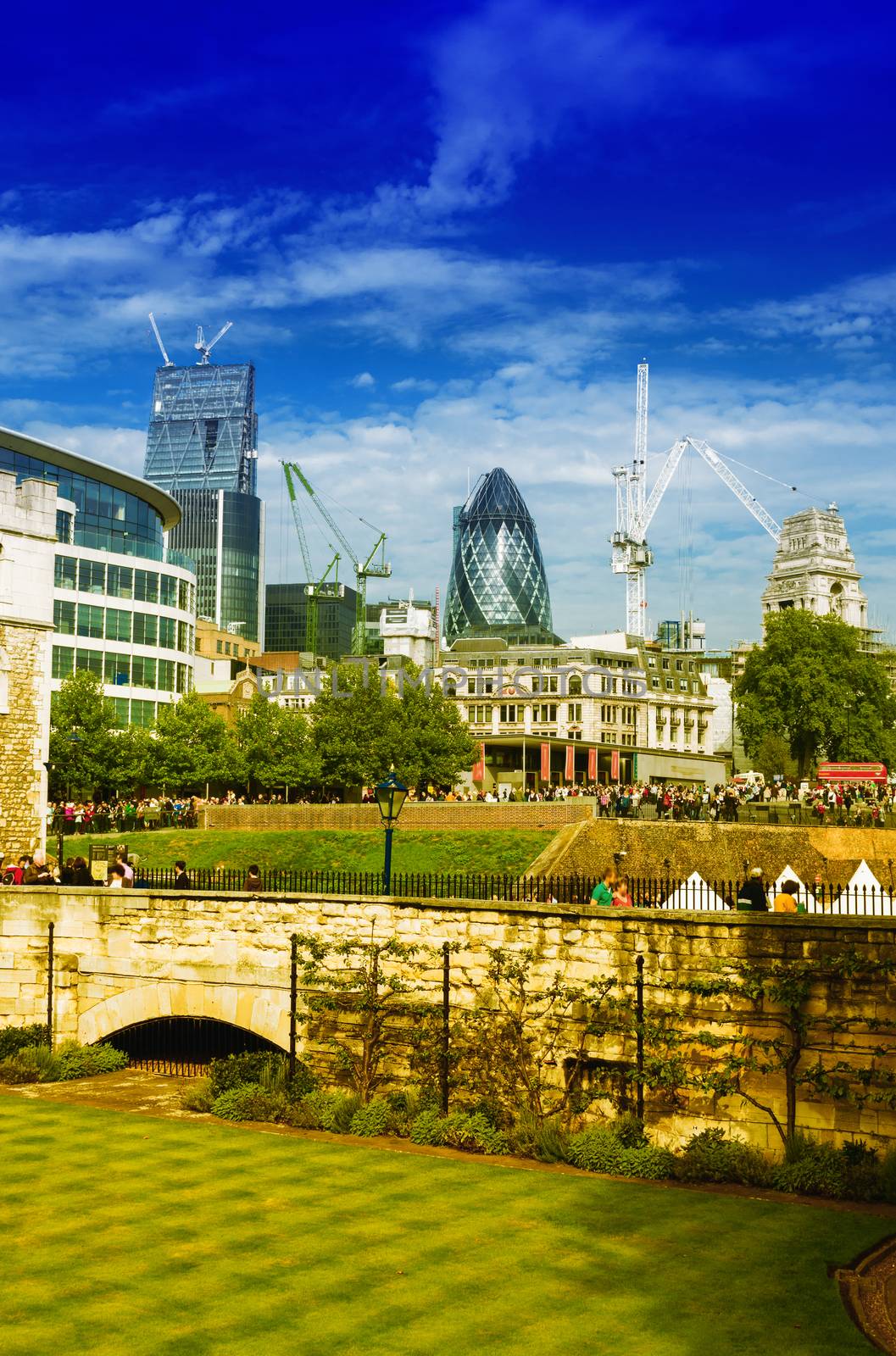 Gardens of Tower of London with city skyline on background by jovannig