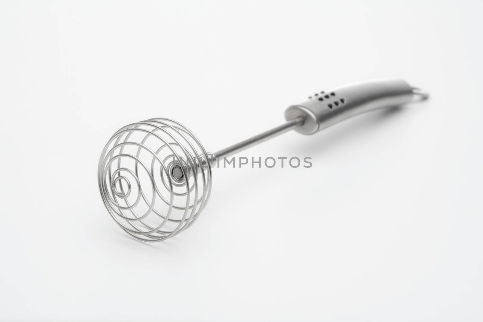 closeup of silver whisk isolated on white background