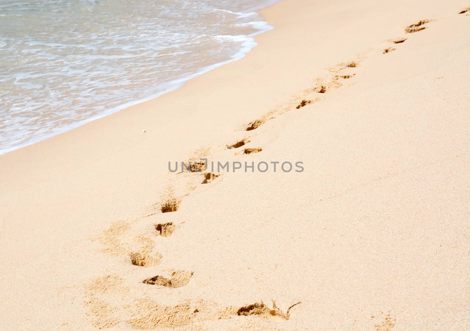 Tropical beach with footprints in soft sand, Southern Province, Sri Lanka, Asia.