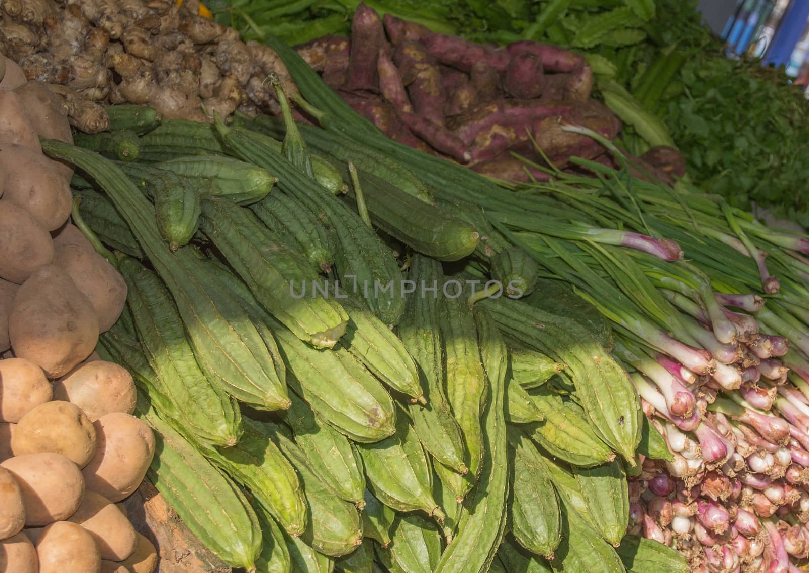Vegetables in the market. Market stall with potatoes, onions, ginger and other vegetables on December 15, 2014 in Tangalle, Southern Province, Sri Lanka, Asia.