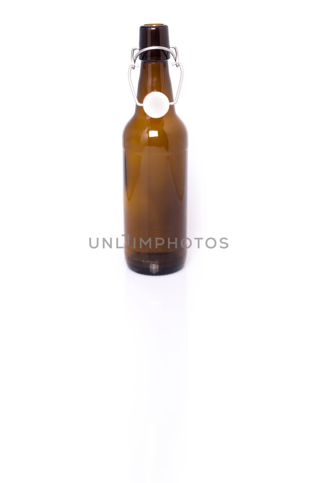Traditional bavarian beer bottle with swing top with reflection and shadow on white. Labels removed for your own branding if needed.