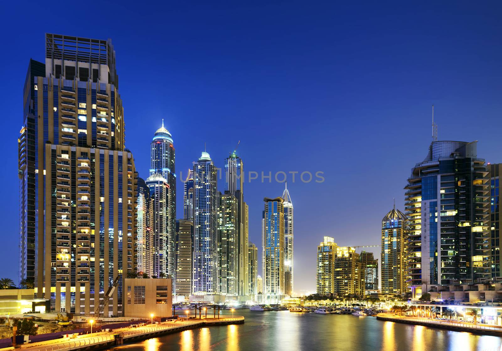 skyline of Dubai Marina at night with boats, United Arab Emirates, Middle East