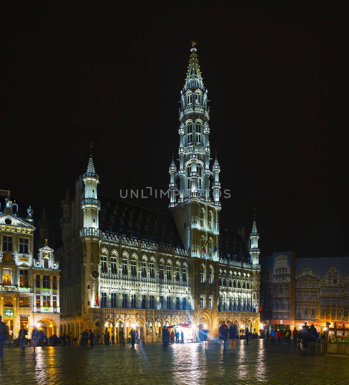 BRUSSELS - OCTOBER 6, 2014: Grand Place with the City Hall on October 6, 2014 in Brussels, Belgium. It's a Gothic building from the Middle Ages.