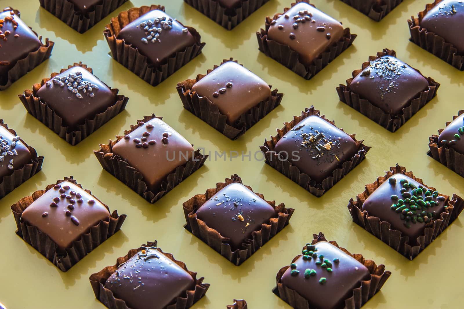 Handmade chocolates arranged in grid by huntz