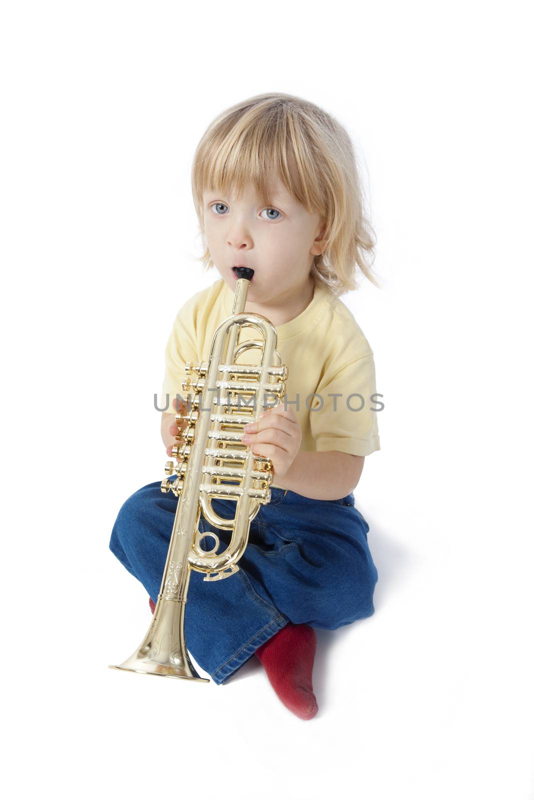 boy with toy trumpet by courtyardpix