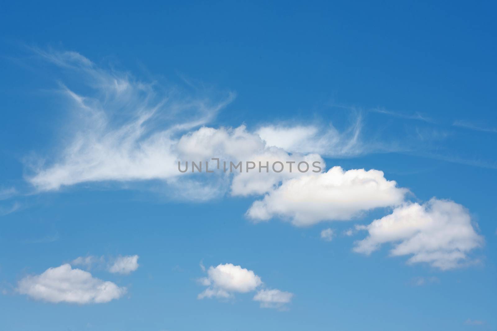 beautiful blue summer sky with fluffy white clouds