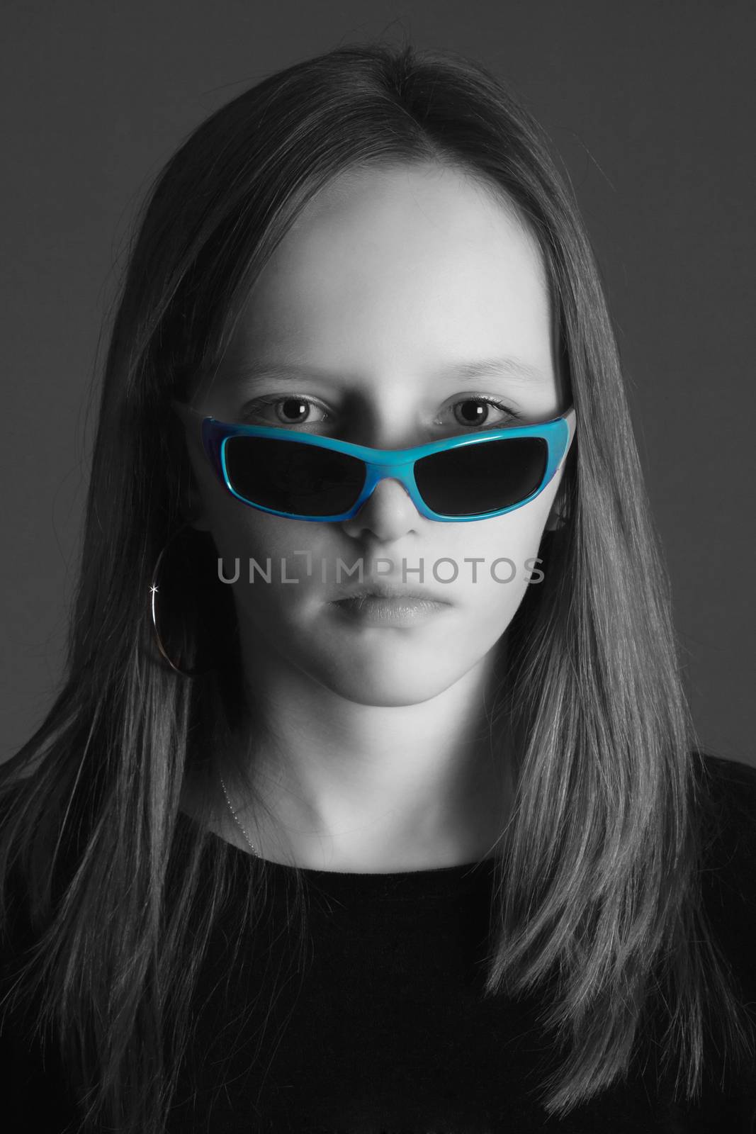 studio portrait of a pretty, eleven years old girl