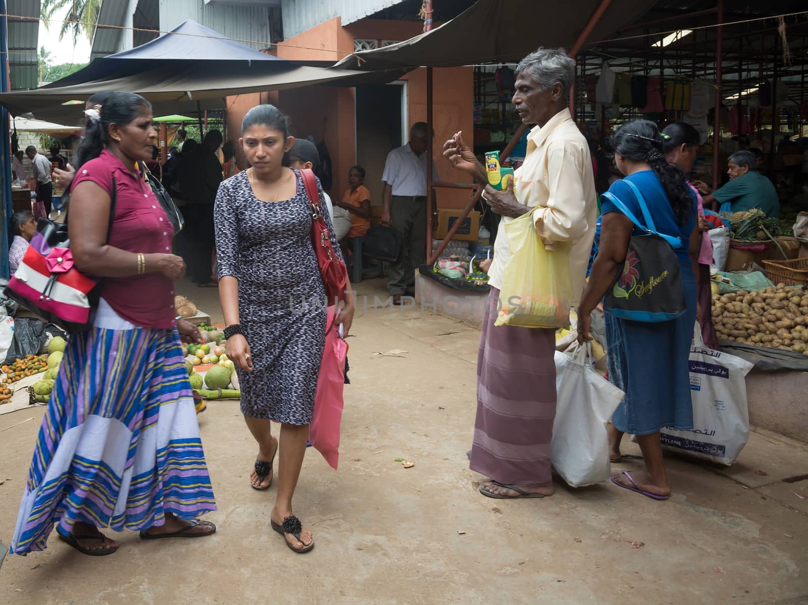 TANGALLE, SOUTHERN PROVINCE, SRI LANKA - DECEMBER 17, 2014: Rat poison and vegetable vendors in the market on December 17, 2014 in Tangalle, Southern Province, Sri Lanka, Asia.