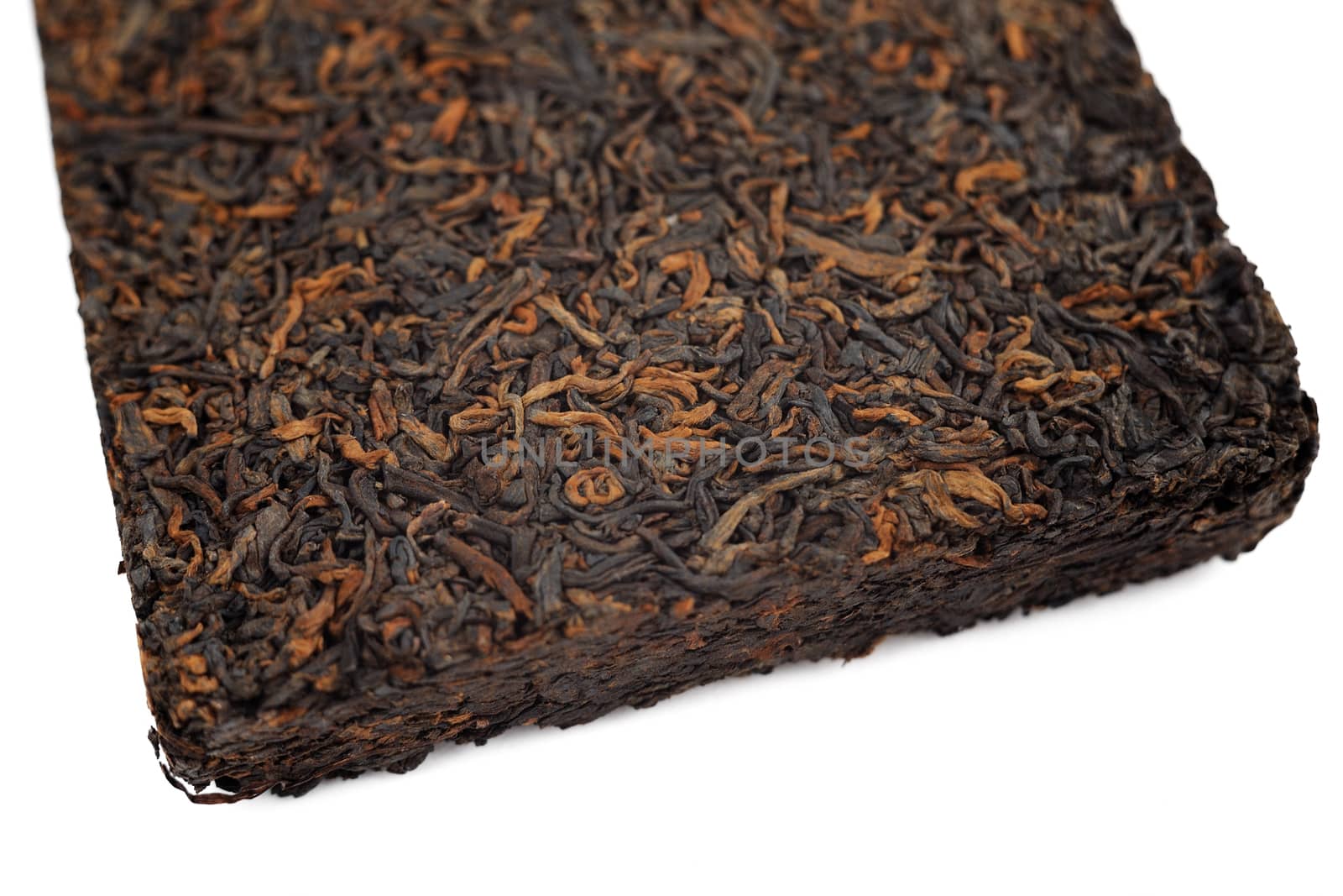 Ripe black puerh brick closeup macro isolated