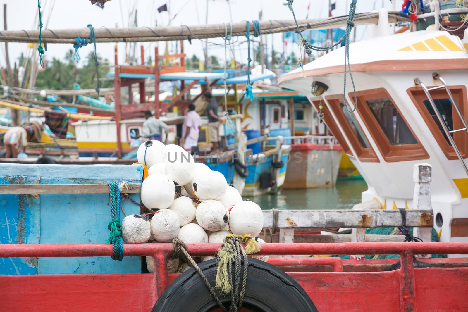 TANGALLE, SOUTHERN PROVINCE, SRI LANKA, ASIA - DECEMBER 20, 2014: Colorful wood fishing boats moored on December 20, 2014 in Tangalle port, Southern Province, Sri Lanka.