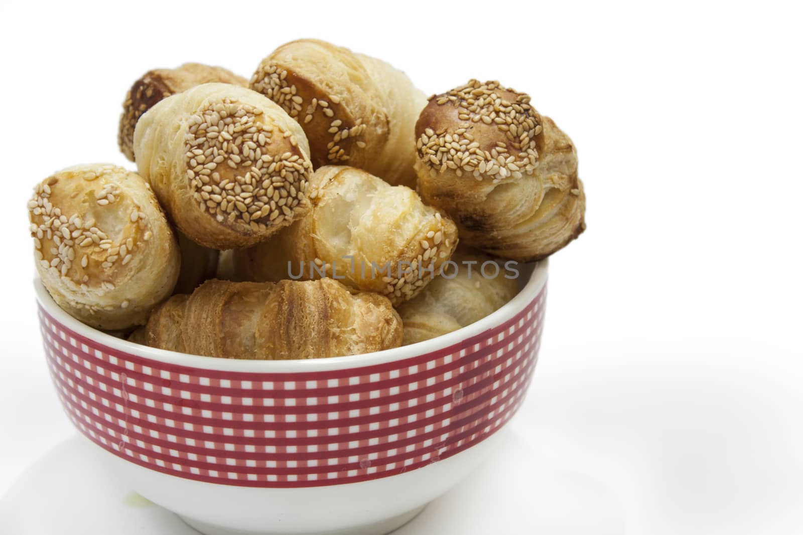 Pastry in the porcelain bowl with white background.
