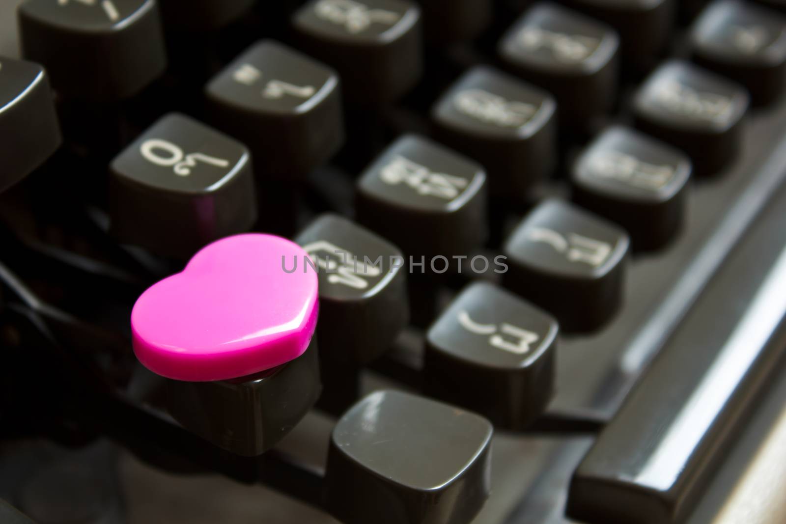 Heart on buttons of typewriter. by Tachjang