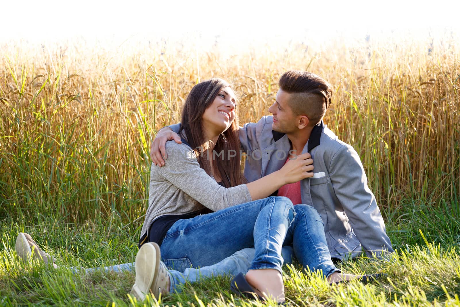 Happy smiling young couple outdoor. valentine concept by artush