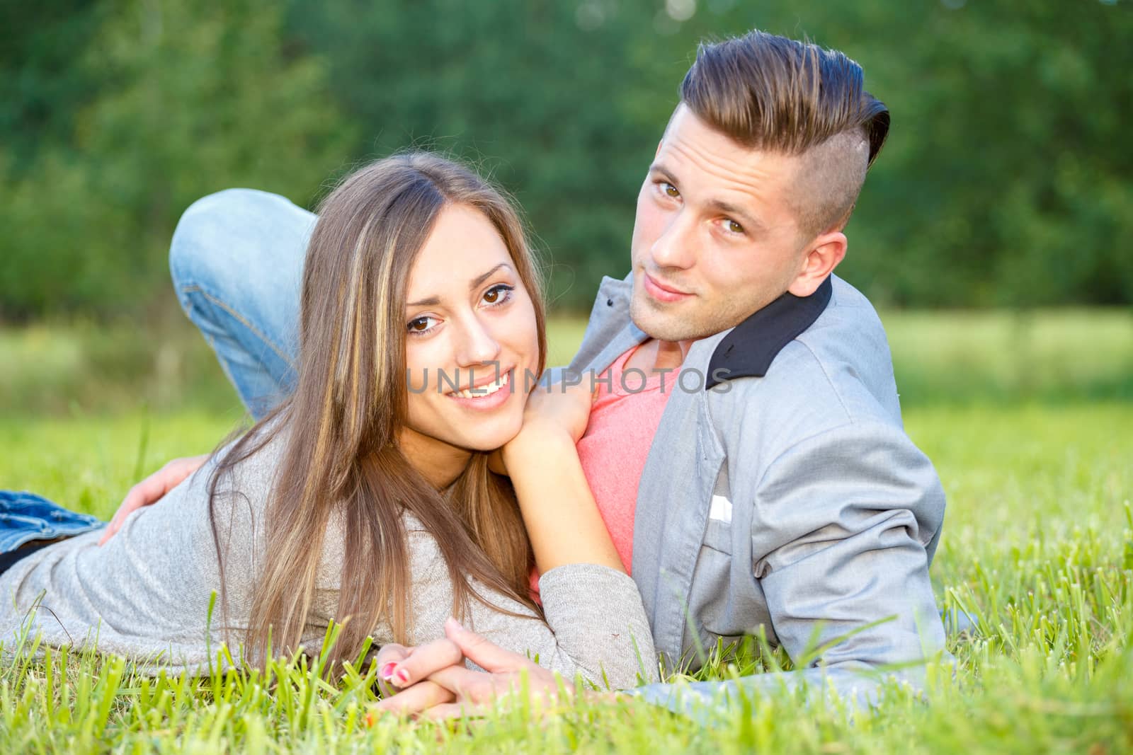 Happy smiling young couple outdoor. valentine concept by artush