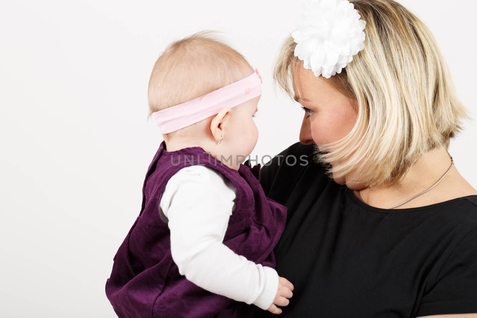 mother with her cute little baby girl, first year of the new life