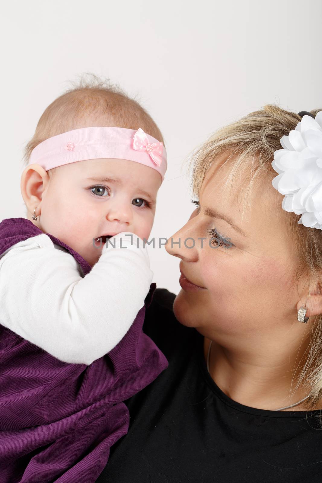 mother with her cute little baby girl, first year of the new life