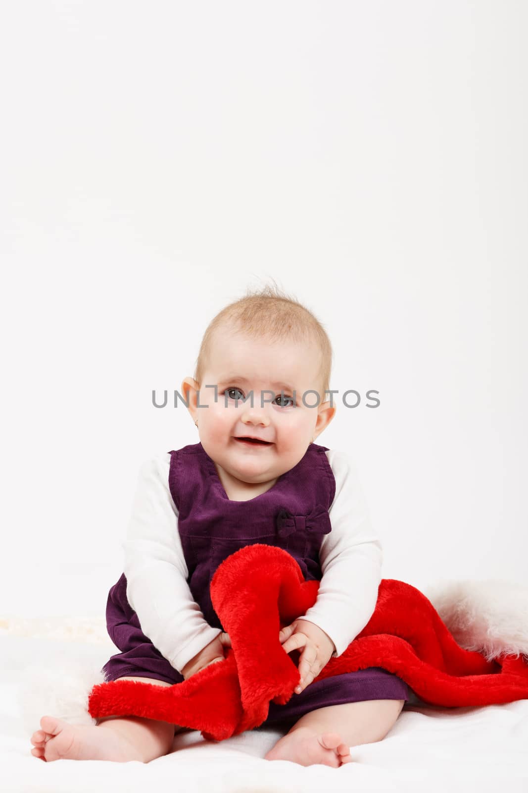 Child girl with Christmas santa hat on white background