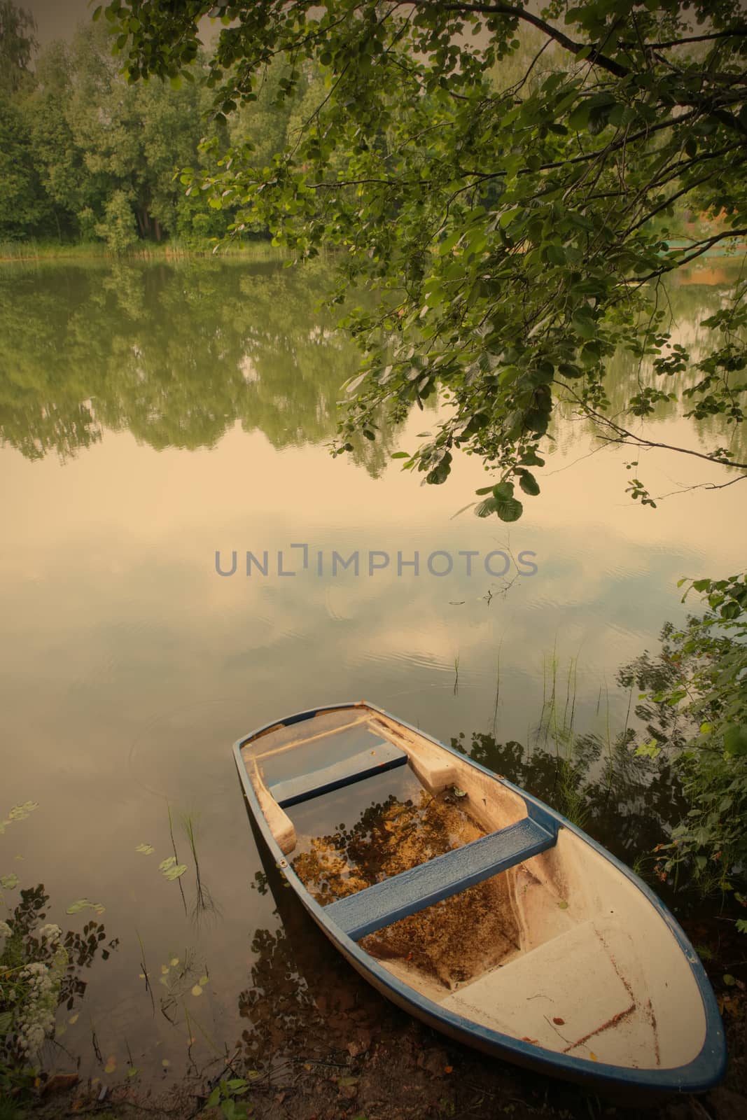 landscape with white-blue old boat ashore calm lake, instagram image style