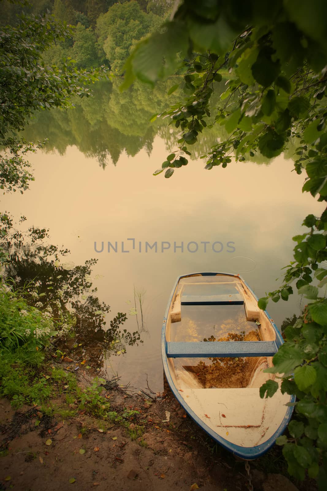 old boat on the coast of the calm lake, instagram image style