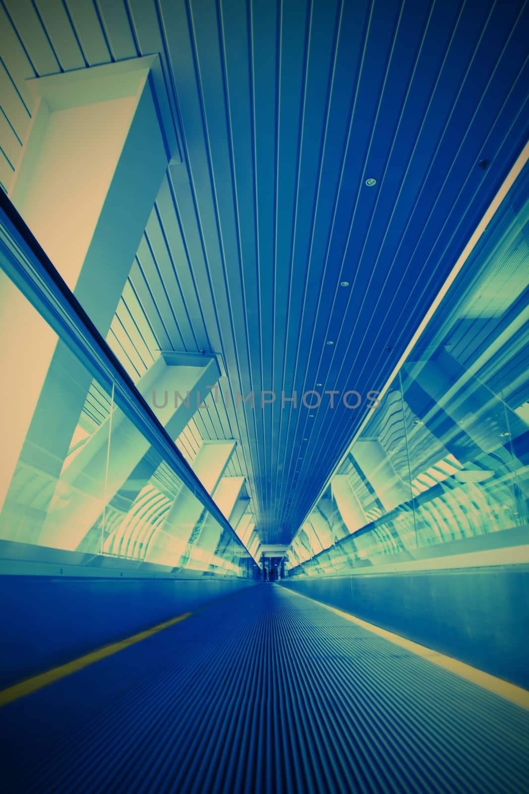 blurred moving escalator in the businnes center, instagram image style