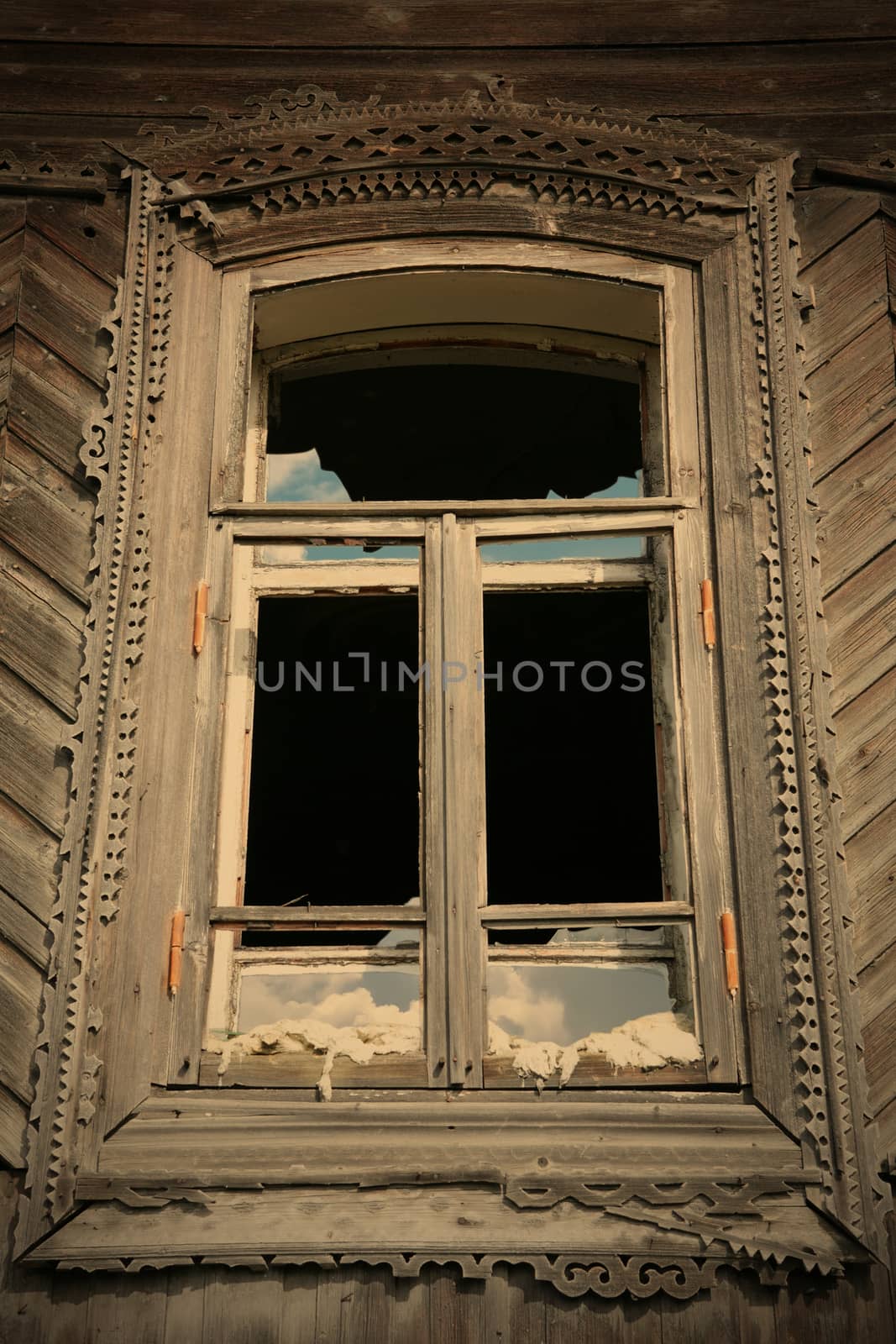window of the old-time building with splinter glass, Ural culture, Russia, instagram image style
