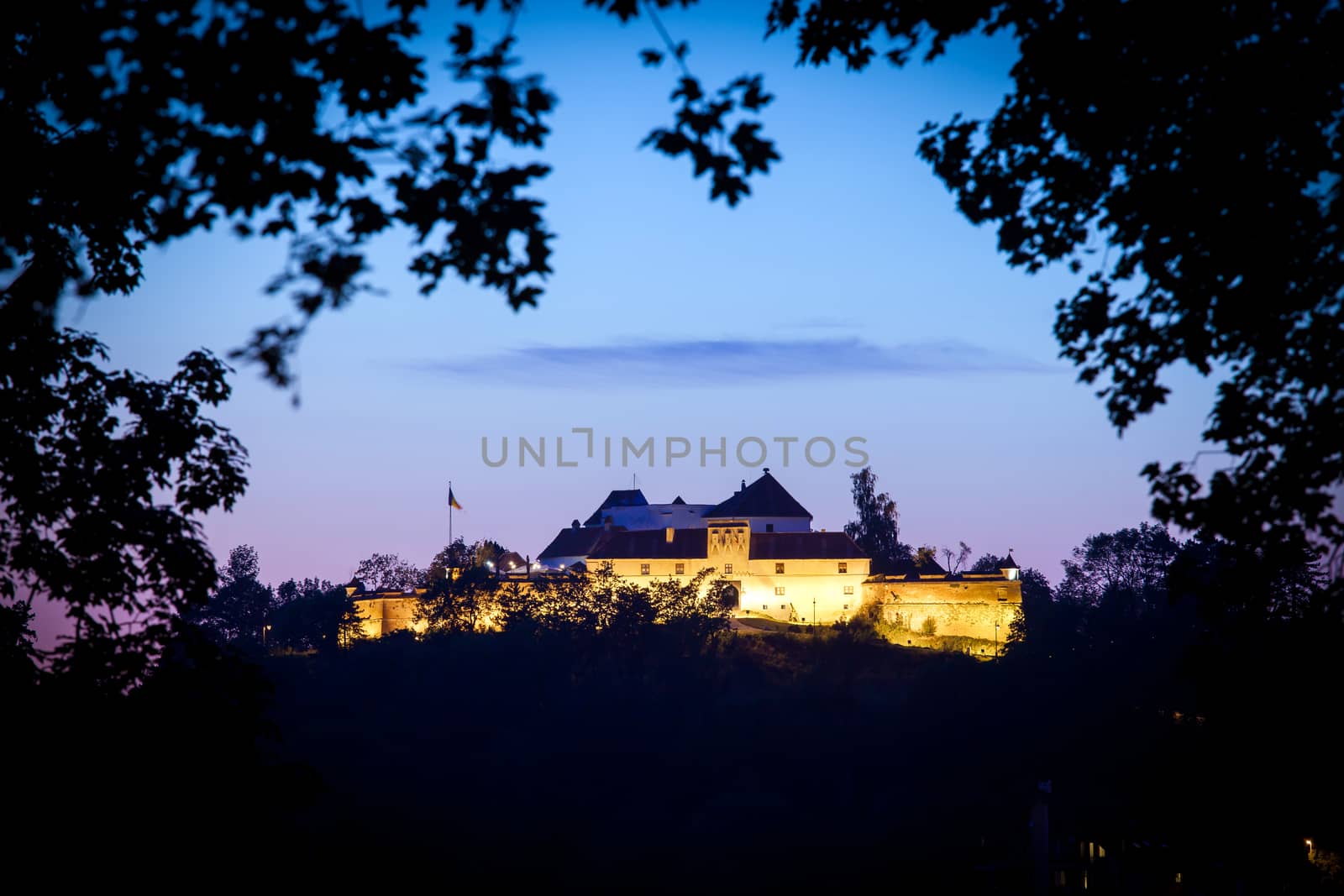 Brasov, Romania - July 24, 2013: Old fortress "Cetatuia" illuminated at night, Brasov, Romania